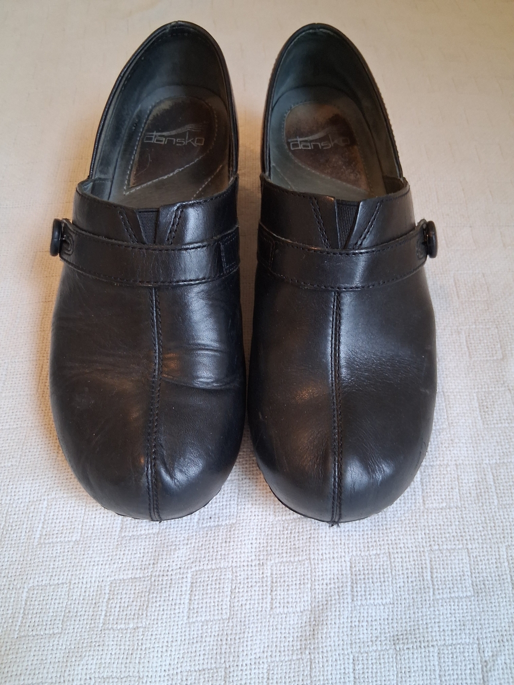 Dansko Black Leather Women's Slip-On Clogs with Button Strap